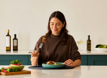 Woman enjoying mindful eating with balanced meal on GLP-1 program